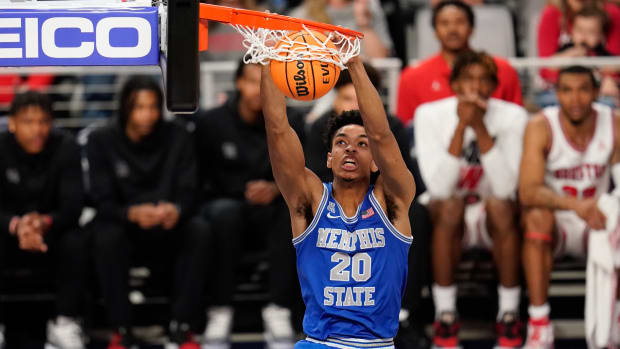 Memphis Tigers forward Josh Minott (20) dunks the ball against the Houston Cougars during the first half at Dickies Arena.
